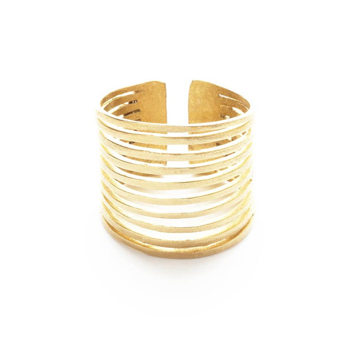 a stack of gold rings on a white background