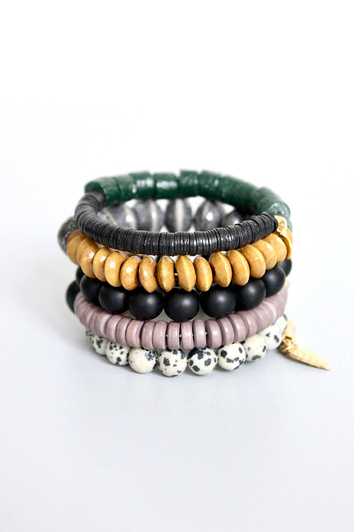 a stack of bracelets with different colored beads