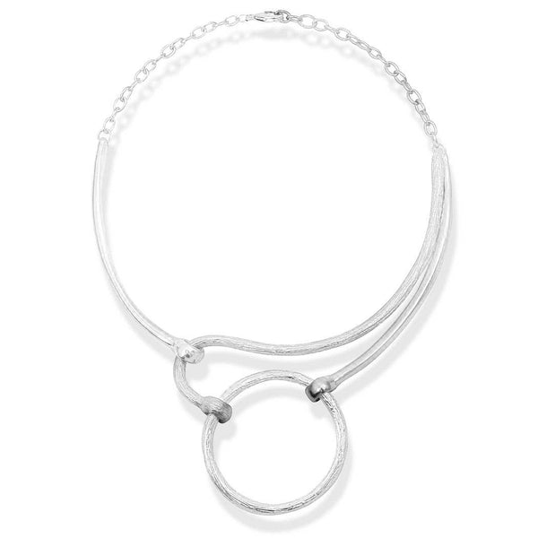 a silver necklace with a circle on it