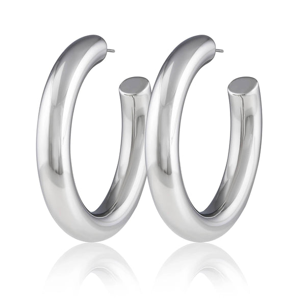 a pair of silver hoop earrings on a white background