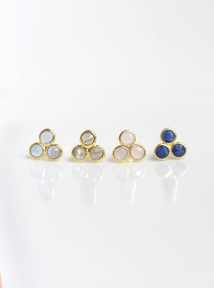 a group of three rings sitting on top of a white table