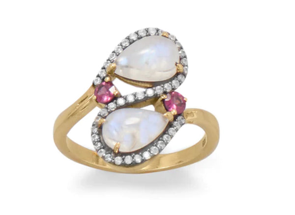 a gold ring with white and pink stones