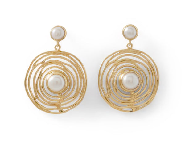 a pair of earrings with pearls on them