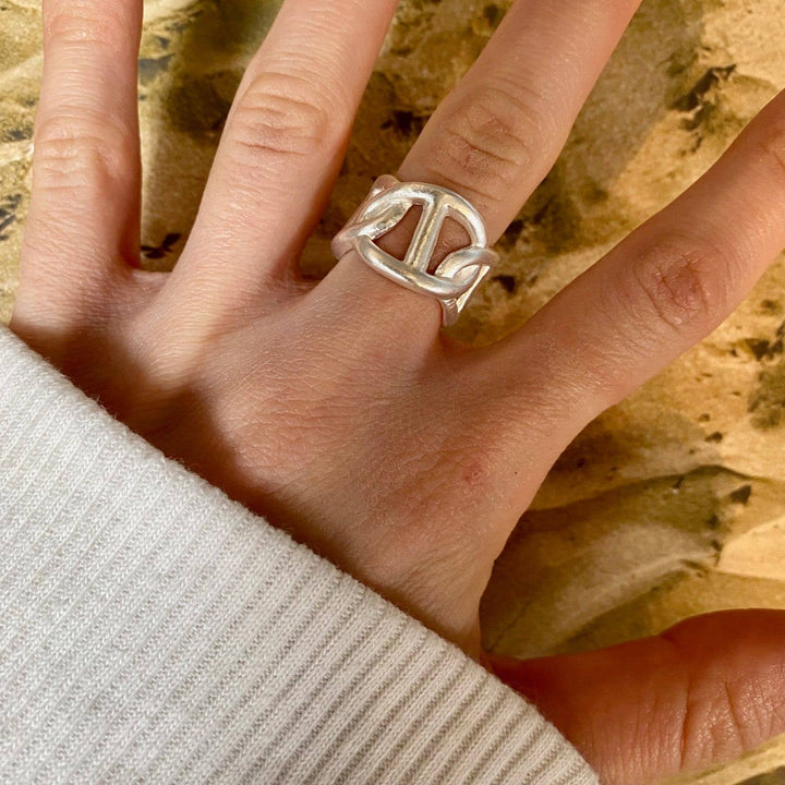 a woman's hand with a ring on it