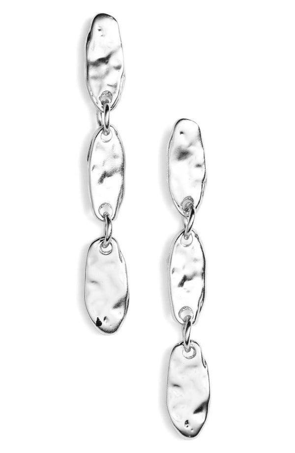 a pair of silver earrings on a white background