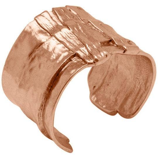 a rose gold ring on a white background