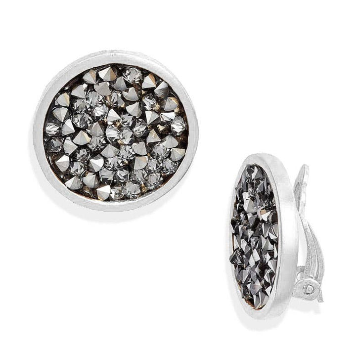 a pair of earrings on a white background