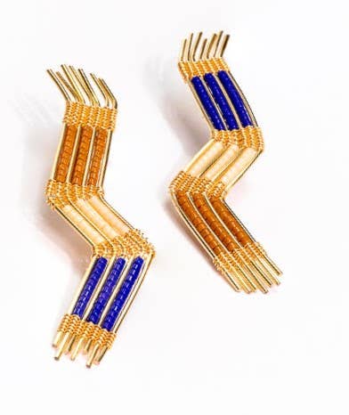 a pair of blue and gold earrings