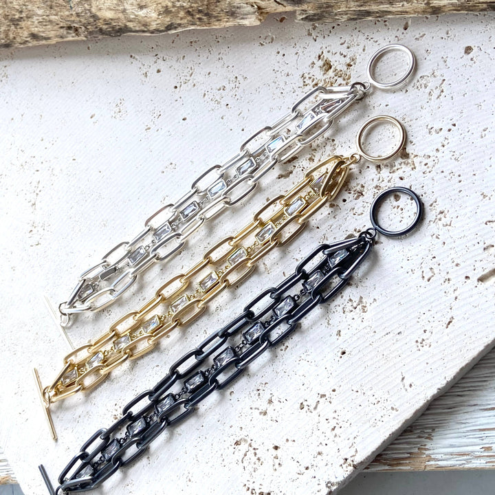 a bunch of different types of chains on a table