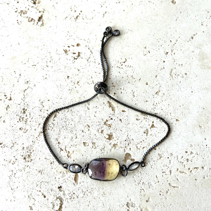 a picture of a bracelet with a stone on it