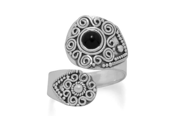 a silver ring with a black stone in the center